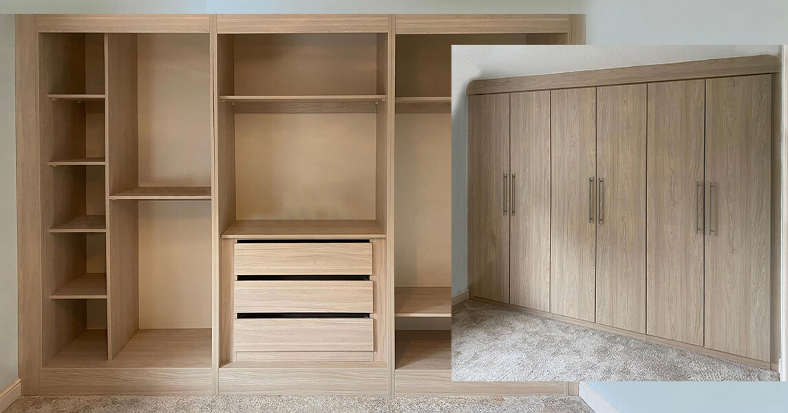 Fitted wardrobes in a mid oak finish with hanging rails, fitted drawers, and shelves.