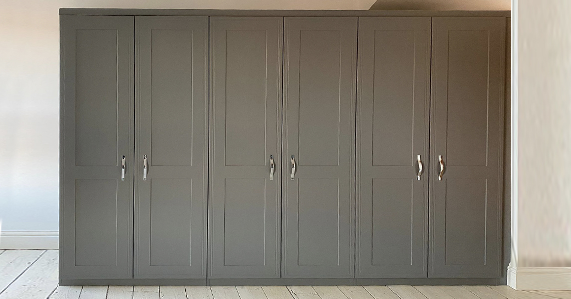 Dark grey fitted wardrobes with shaker-style doors.