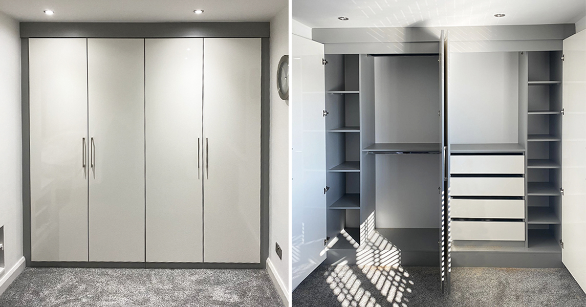 Fitted wardrobes with hanging rails, fitted drawers, and open shelves in a cream gloss and dark grey finish.